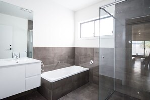 Shower, hair dryer, towels, toilet paper