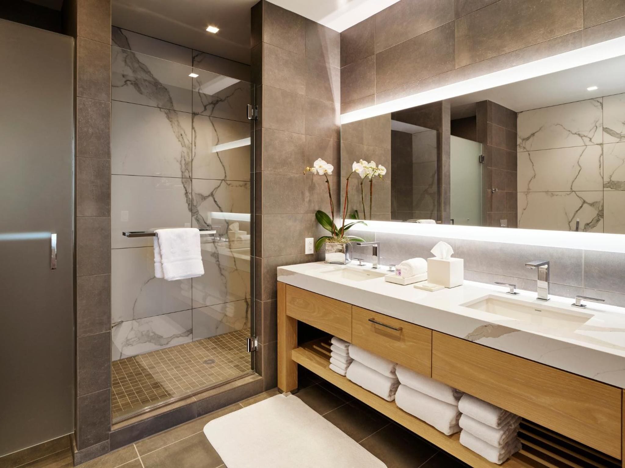 deluxe double queen | bathroom | designer toiletries, hair dryer, bathrobes, towels