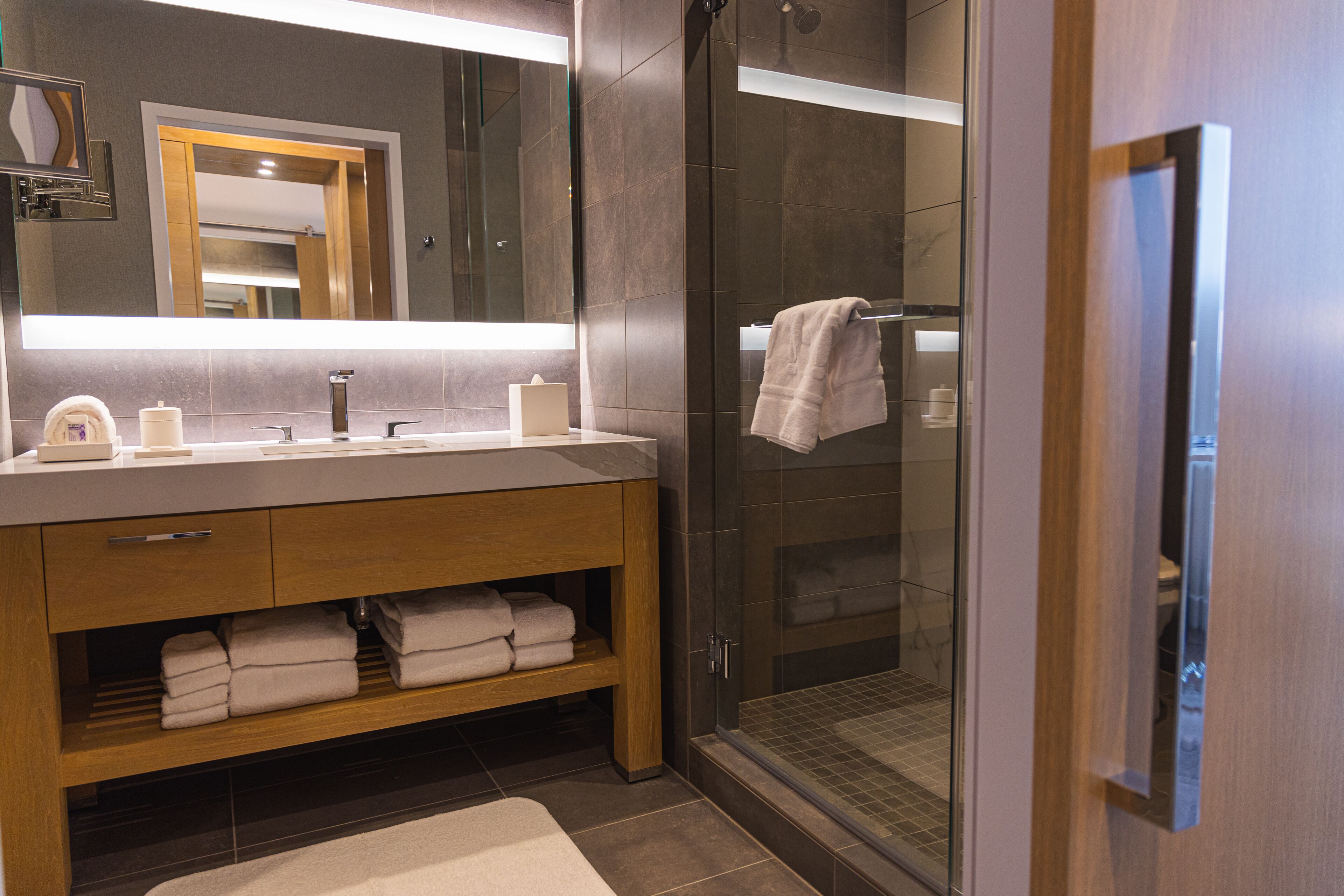 designer toiletries, hair dryer, bathrobes, towels