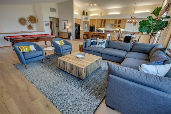Spacious living room with high end comfortable furniture.