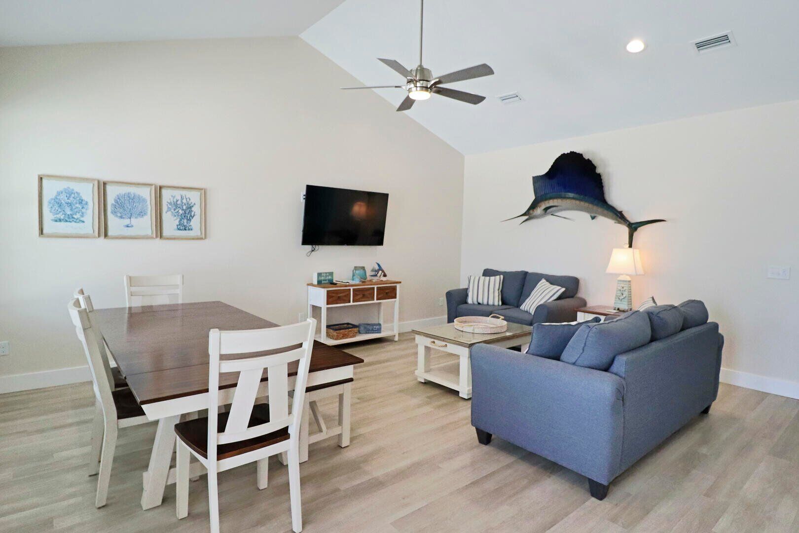 JUST A BREEZE AWAY IS A MODERN 3BD SINGLE LEVEL! STEPS FROM BEACH, RESTAURANTS! BOAT PARKING!