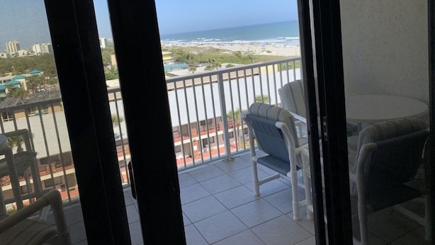 A balcony with a view of the beach and ocean. - SANDCASTLES OCEAN VIEW TOP FLOOR..DATES AVAILABLE (check Reviews) (Cocoa Beach)