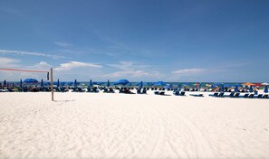 On the beach, sun loungers, beach towels