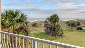 A balcony with a view of the ocean and grassy landscape. - Sea Breeze | Large 1 BR, 2 BA Oceanview Condo! (Fernandina Beach)
