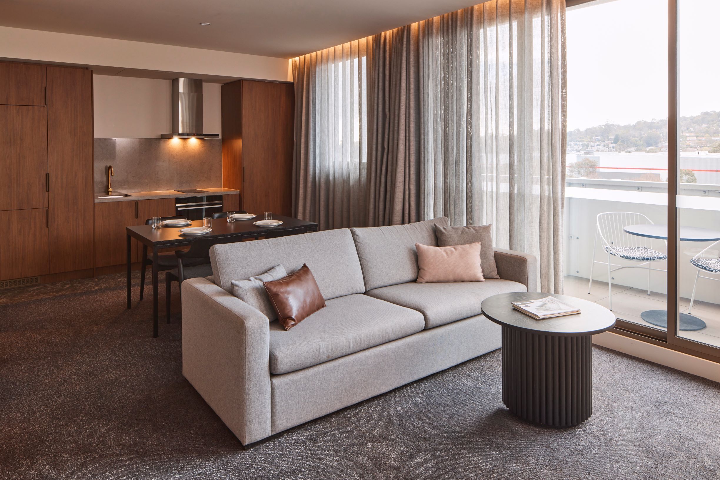 deluxe two bedroom king apartment | living area | flat-screen tv, netflix, streaming services