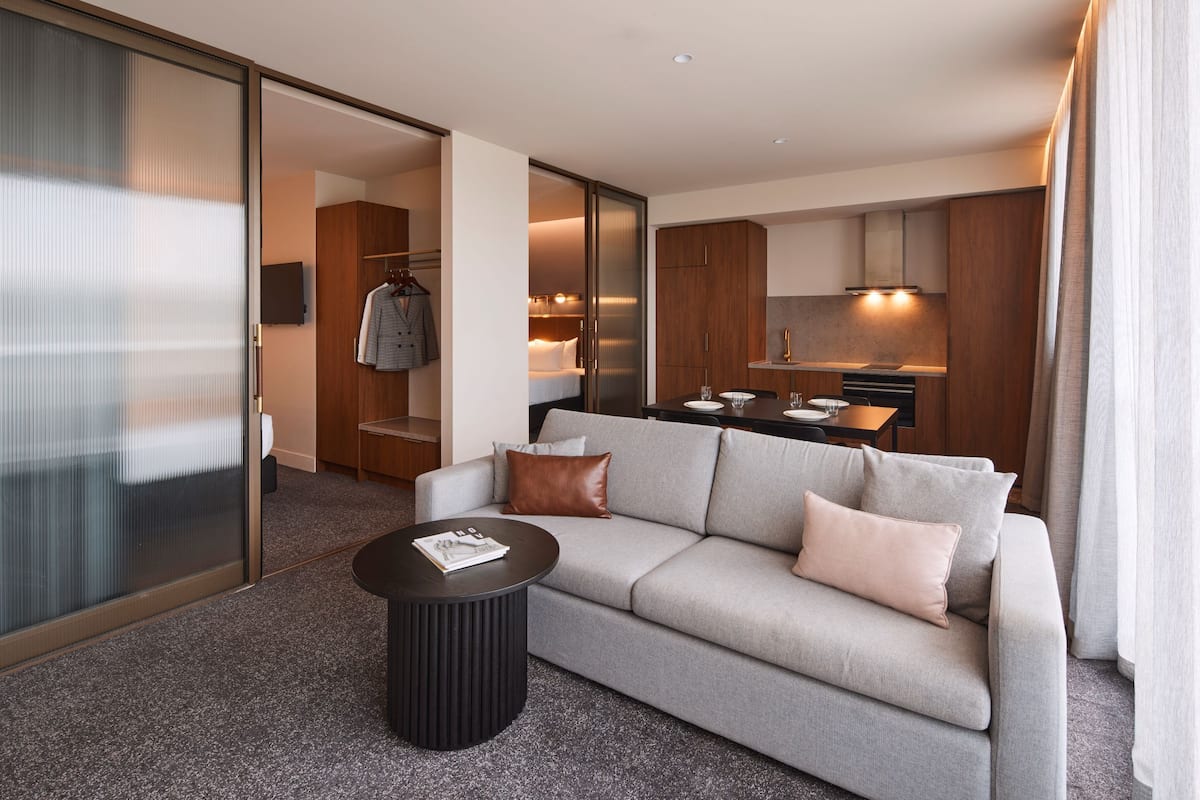 deluxe two bedroom king apartment | living area | flat-screen tv, netflix, streaming services