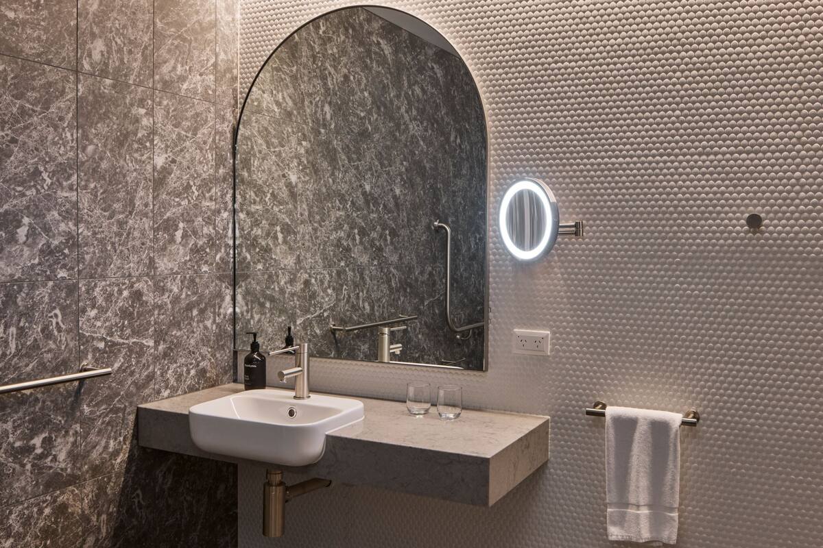 accessible king room | bathroom | shower, rainfall showerhead, free toiletries, hair dryer