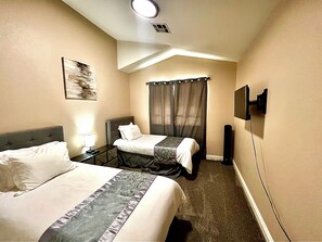 4 bedrooms, desk, iron/ironing board, travel cot