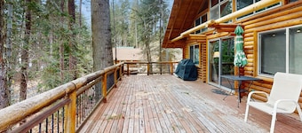 Two-story log home w/loft, lake views, wood stove, furnished deck + beach access