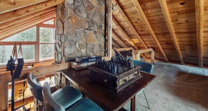 Two-story log home w/loft, lake views, wood stove, furnished deck + beach access
