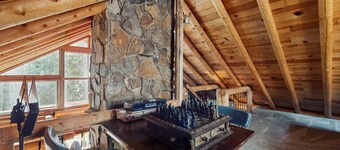 Two-story log home w/loft, lake views, wood stove, furnished deck + beach access