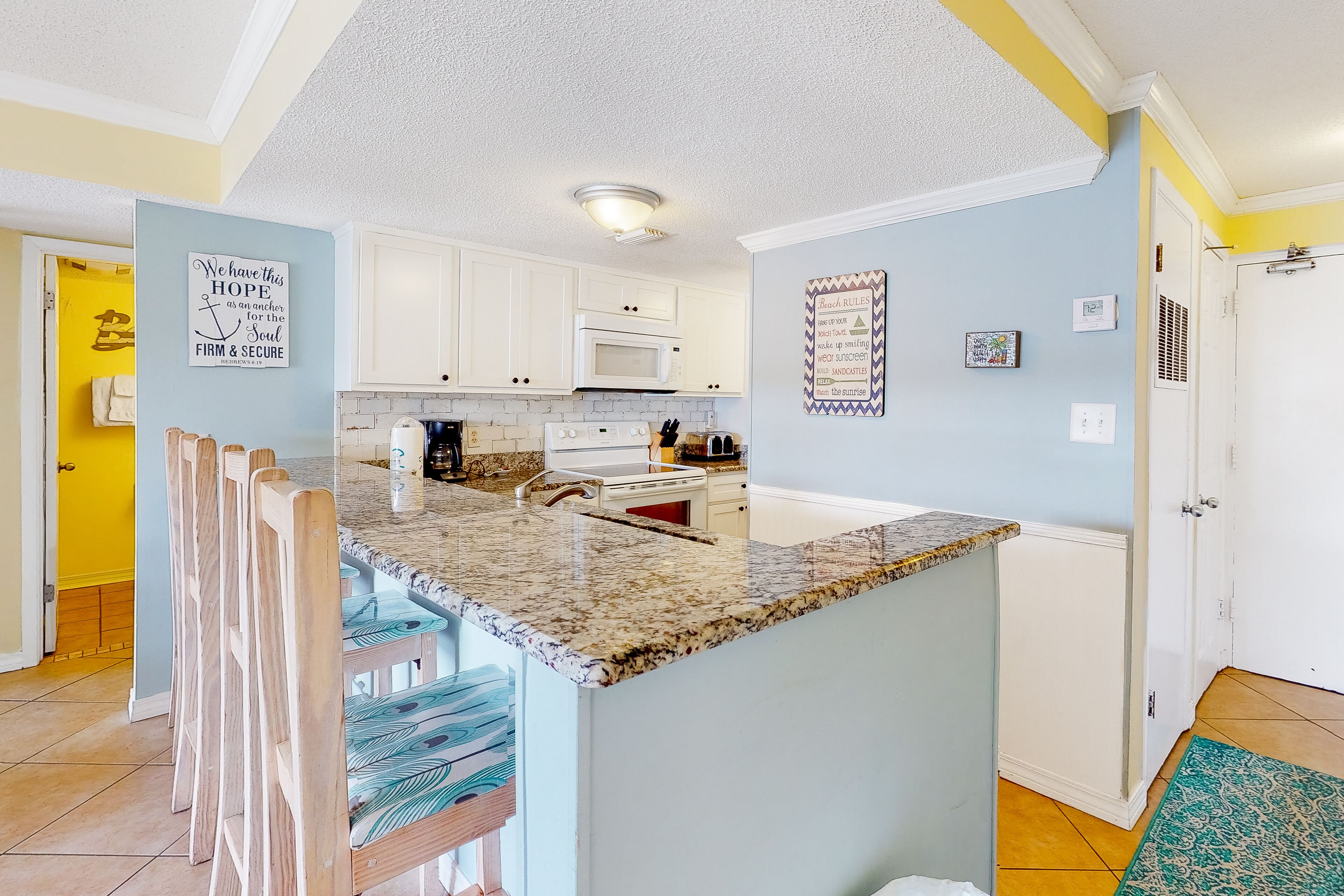 Bright & fun condo with pool, beach access, private balcony & central AC