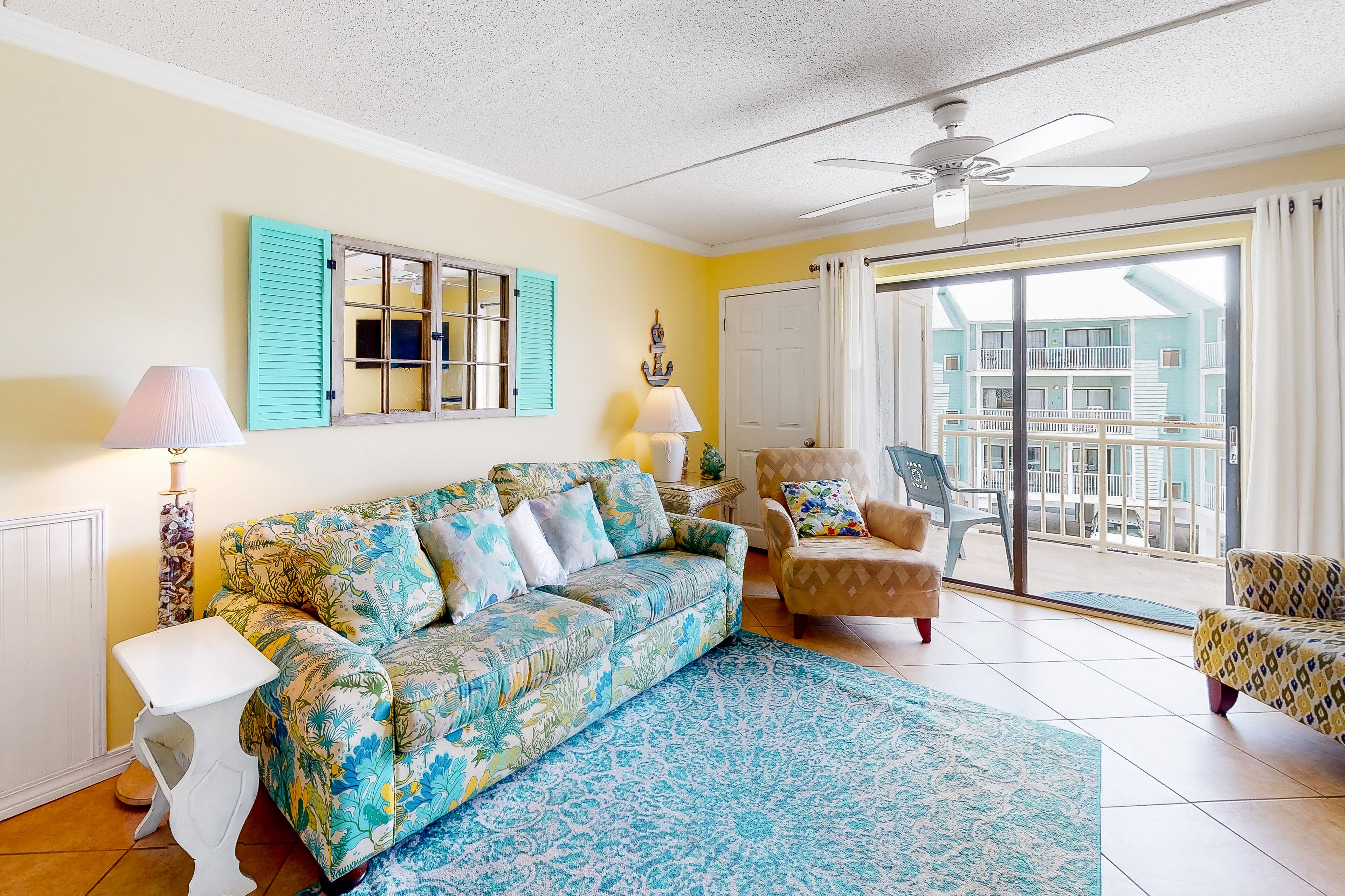 Bright & fun condo with pool, beach access, private balcony & central AC