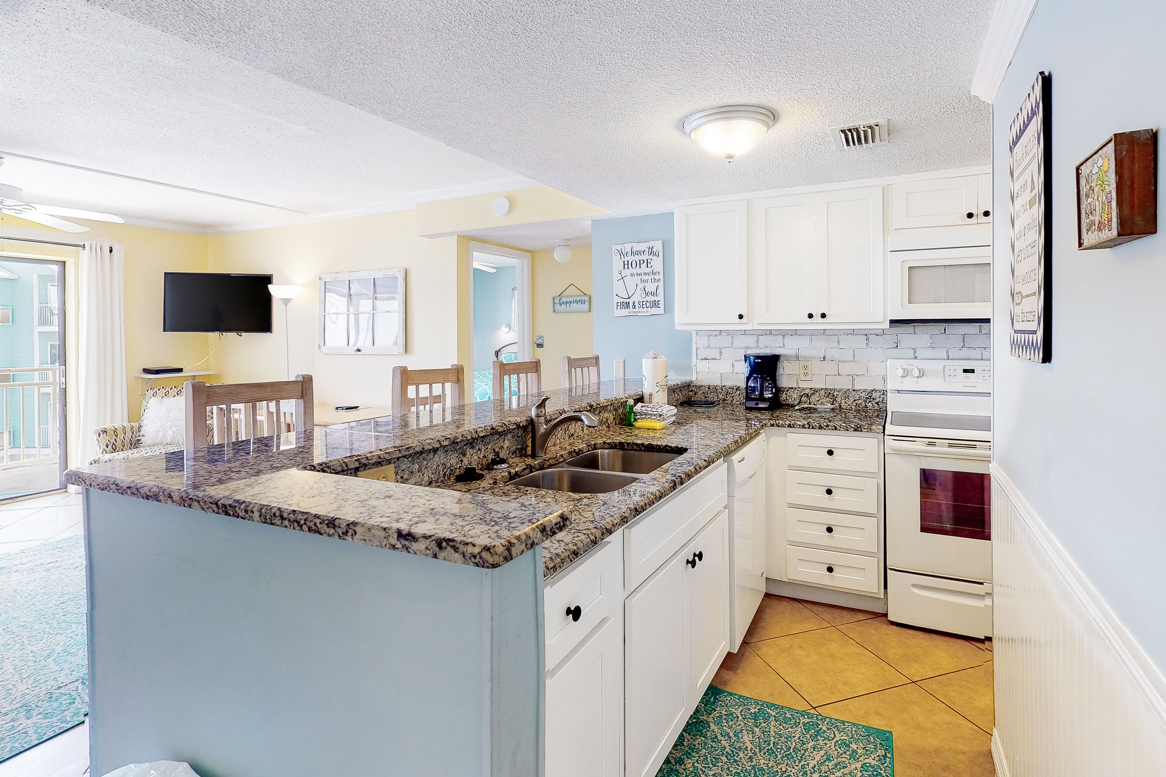 Bright & fun condo with pool, beach access, private balcony & central AC