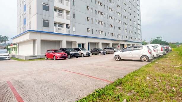 A multi-story parking garage with several cars parked. - Life 2837 Apartment Dramaga Tower (Dramaga)