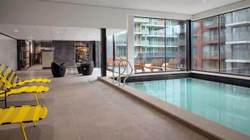 Indoor pool, open 6:00 AM to 11:00 PM, pool loungers