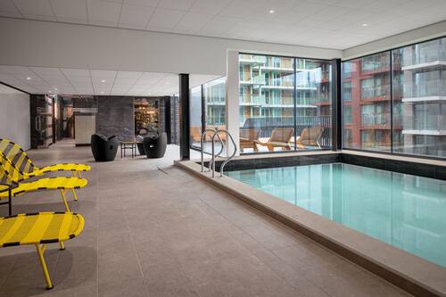 Indoor pool, open 6:00 AM to 11:00 PM, pool loungers