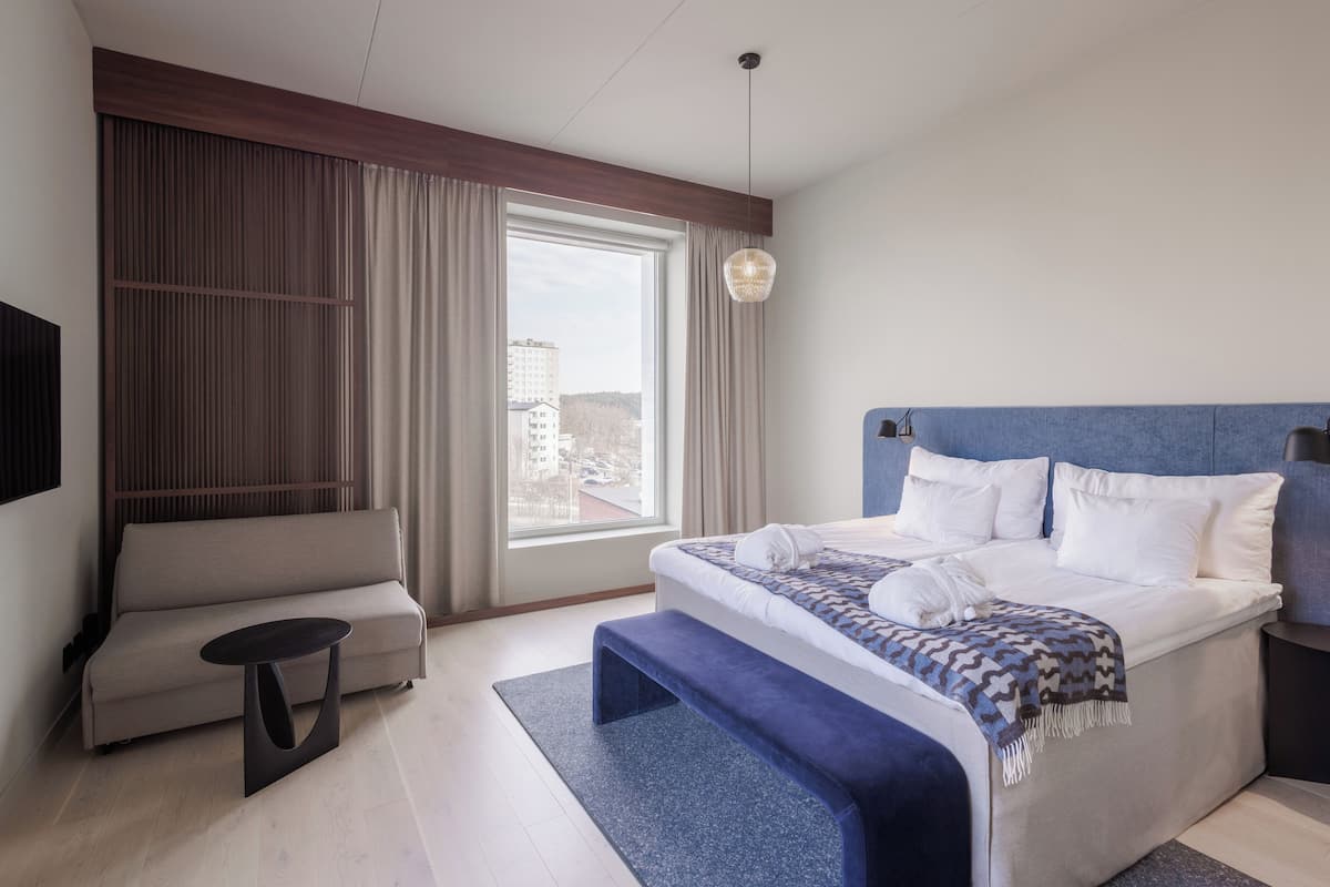 deluxe double room | desk, laptop workspace, blackout curtains, iron/ironing board