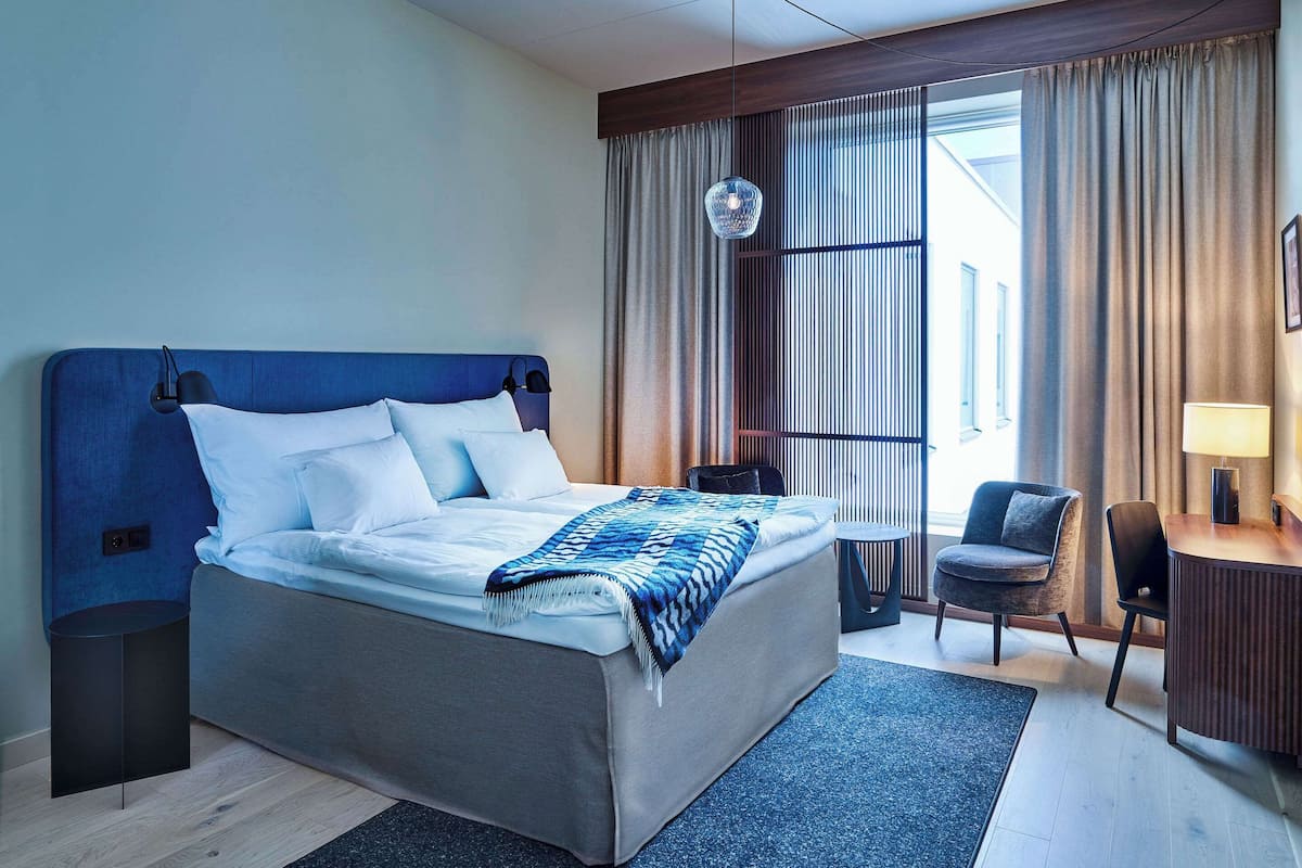 desk, laptop workspace, blackout curtains, iron/ironing board