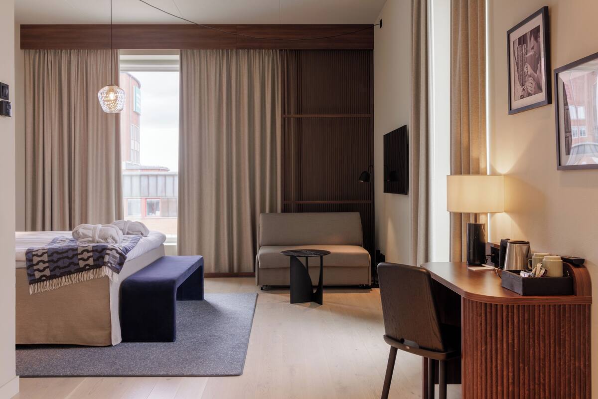 deluxe double room | desk, laptop workspace, blackout curtains, iron/ironing board