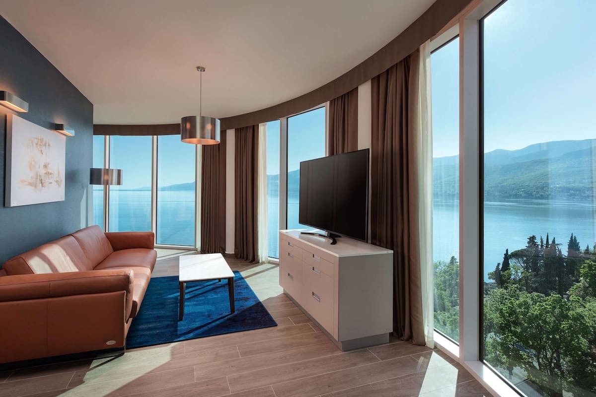 Suite, 1 King Bed (Costabella) | Living area | 55-inch flat-screen TV with cable channels, TV