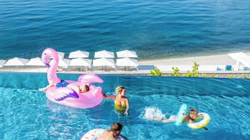 Indoor pool, seasonal outdoor pool, pool umbrellas, pool loungers