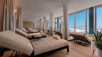 Relax in comfort with reclining lounge chairs and expansive ocean views.