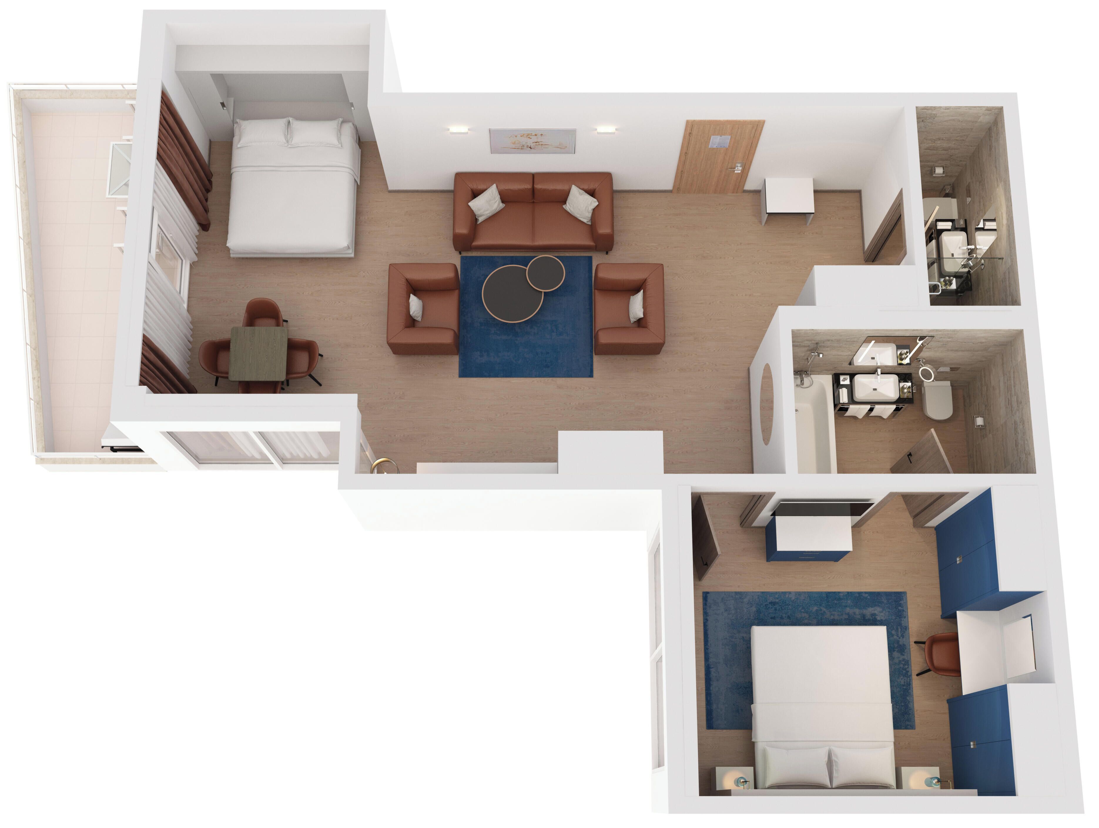 Habitació d'hotel amb llit, zona de seients amb taula i cadires, bany amb dutxa i vàter, i petita cuina.