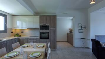 Luxury Villa | Private kitchen | Full-size fridge, microwave, oven, stovetop