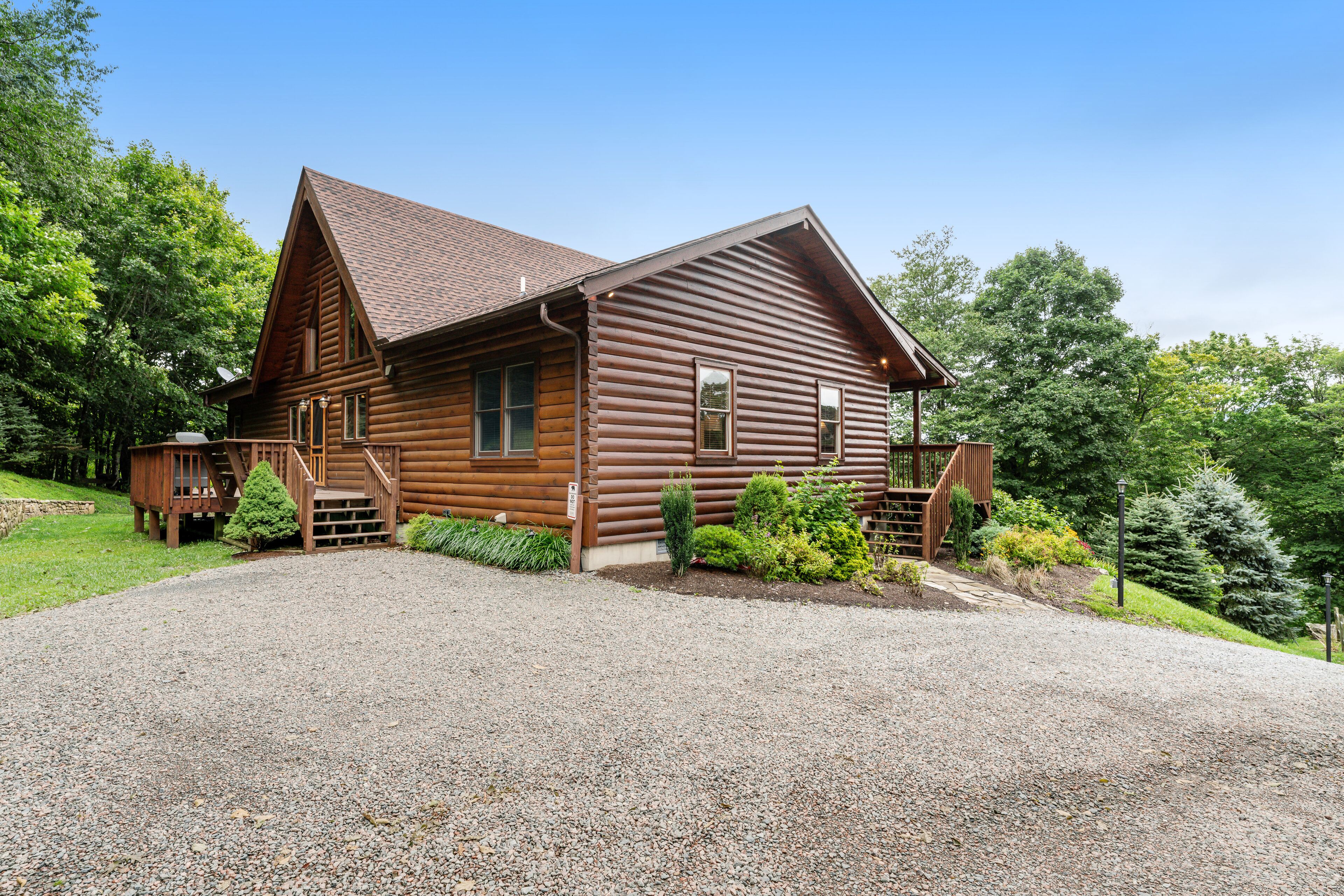 Stunning cabin w/ wraparound deck, firepit, free WiFi, & private hot tub