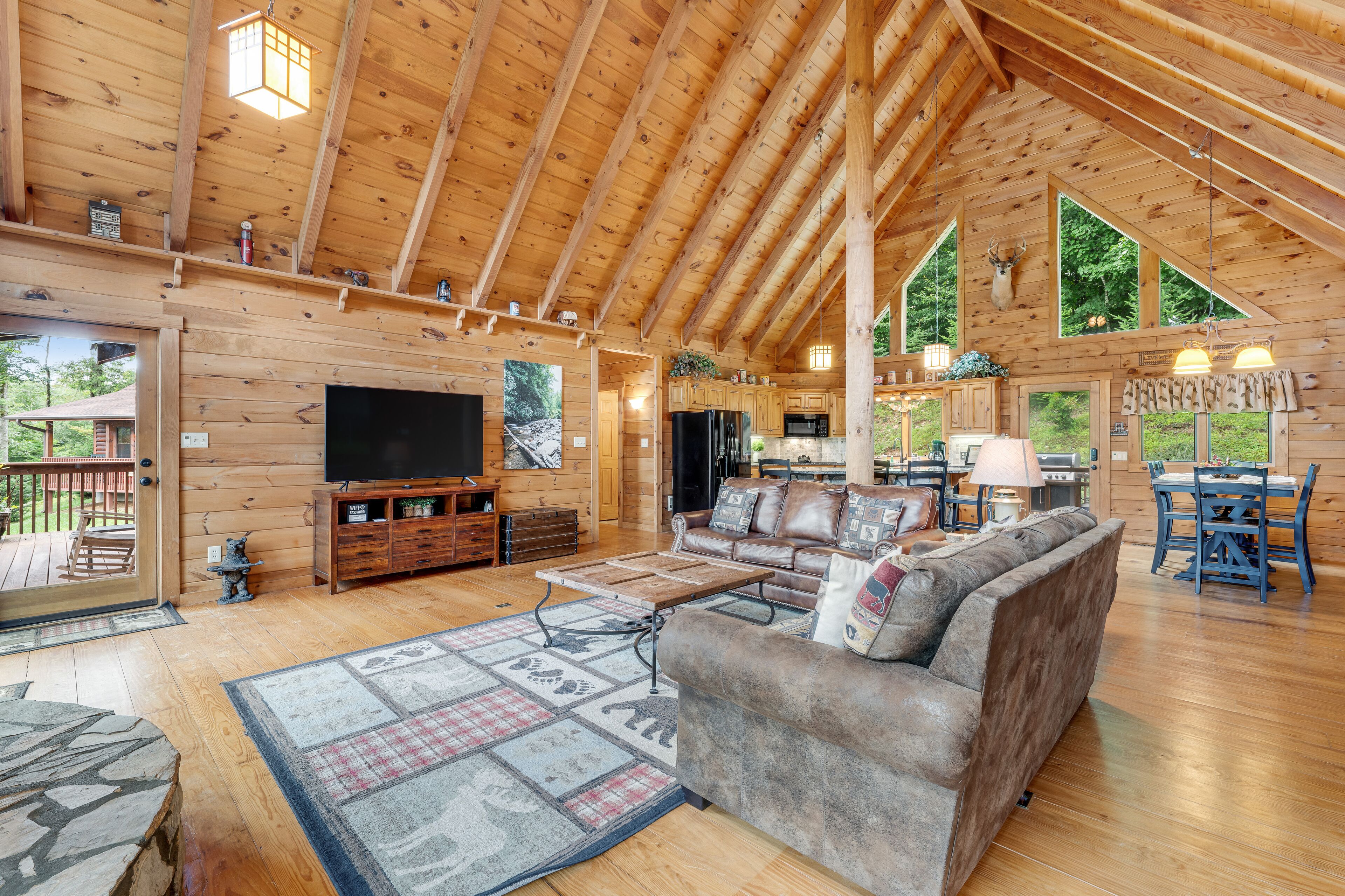 Stunning cabin w/ wraparound deck, firepit, free WiFi, & private hot tub