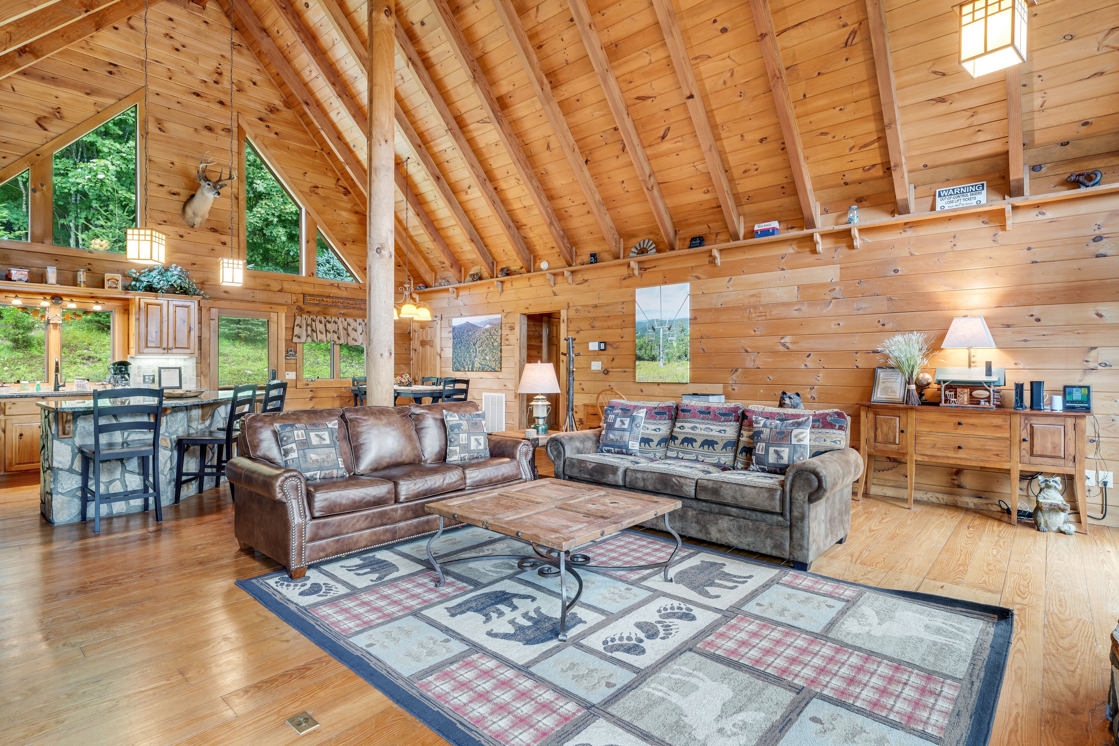Stunning cabin w/ wraparound deck, firepit, free WiFi, & private hot tub
