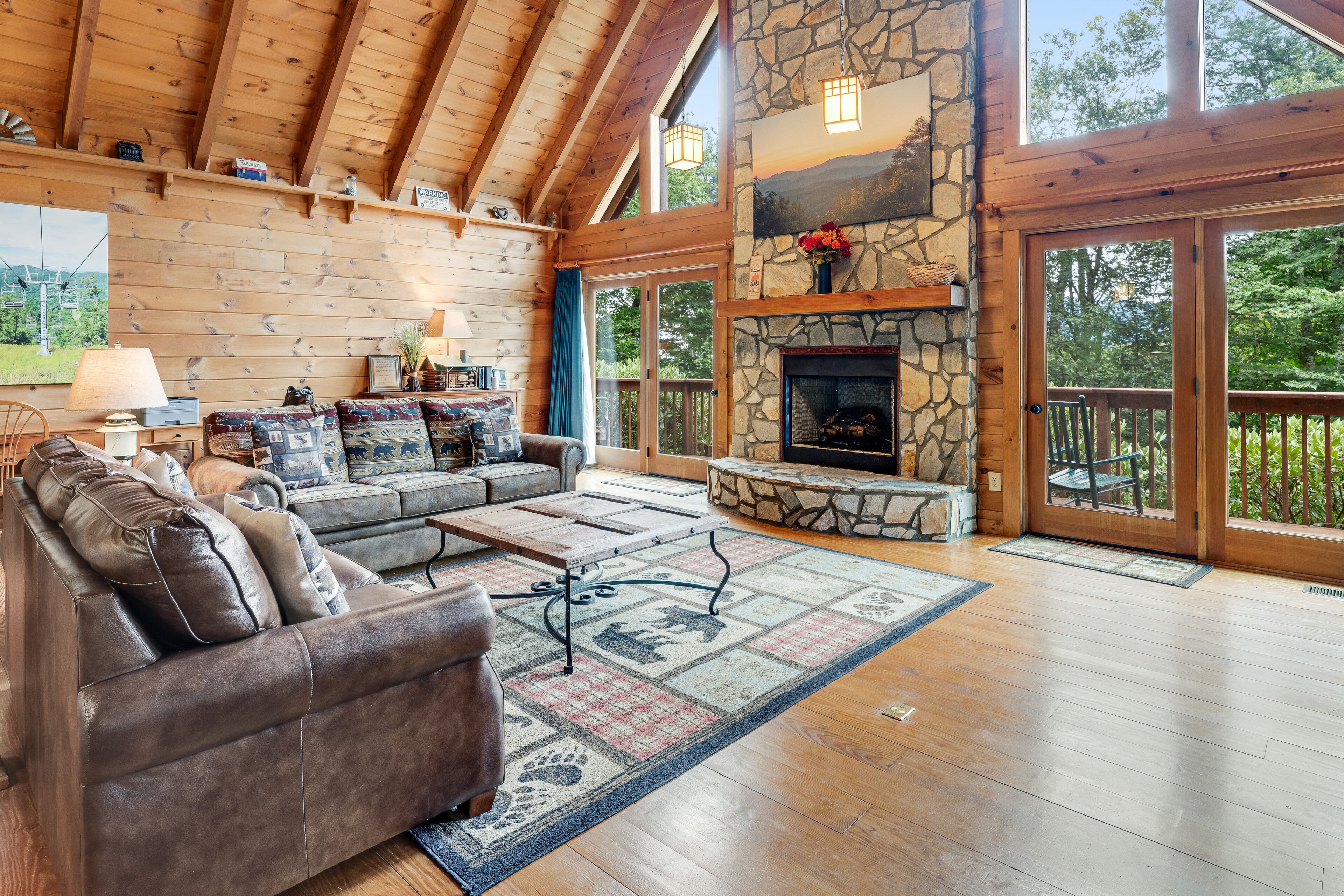 Stunning cabin w/ wraparound deck, firepit, free WiFi, & private hot tub