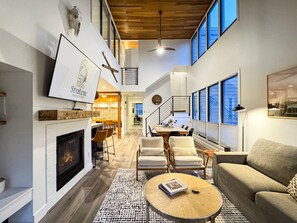 Smart TV, fireplace, books, printers