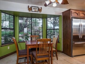 Enjoy meals with a view from the dining table in front of the bay window.
