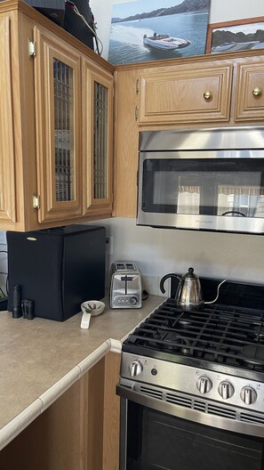Microwave, oven, stovetop, dining tables