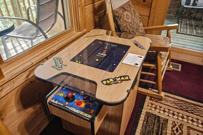 Games room - Romantic secluded Smokies Cabin w/ Hot Tub, Arcade & Free Attraction Tickets! (Sevierville)