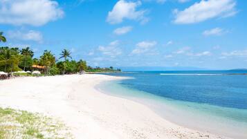 On the beach, sun loungers, beach towels