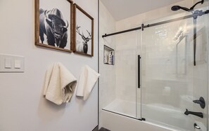 Combined shower/bathtub, hair dryer, towels, soap