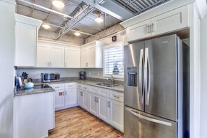 Enjoy cooking in this well-equipped kitchen with a microwave, coffee maker, and refrigerator.