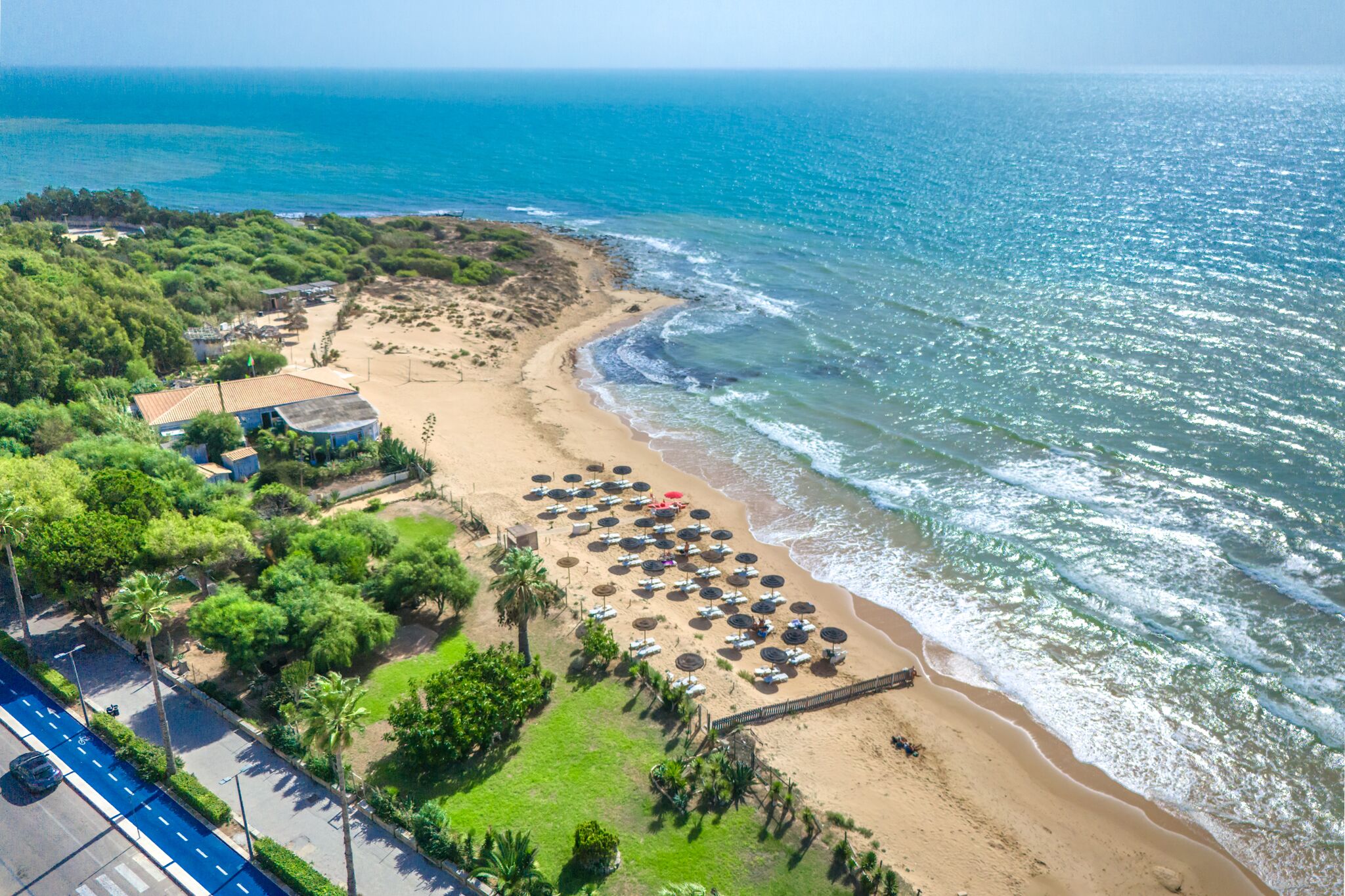 On the beach, sun-loungers