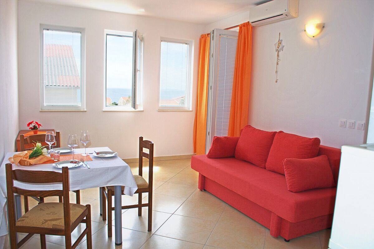 Standard Apartment, 1 Bedroom, Balcony, Sea View | Living area | 60-cm TV with satellite channels