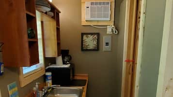 Fridge, microwave, coffee/tea maker, cookware/dishes/utensils