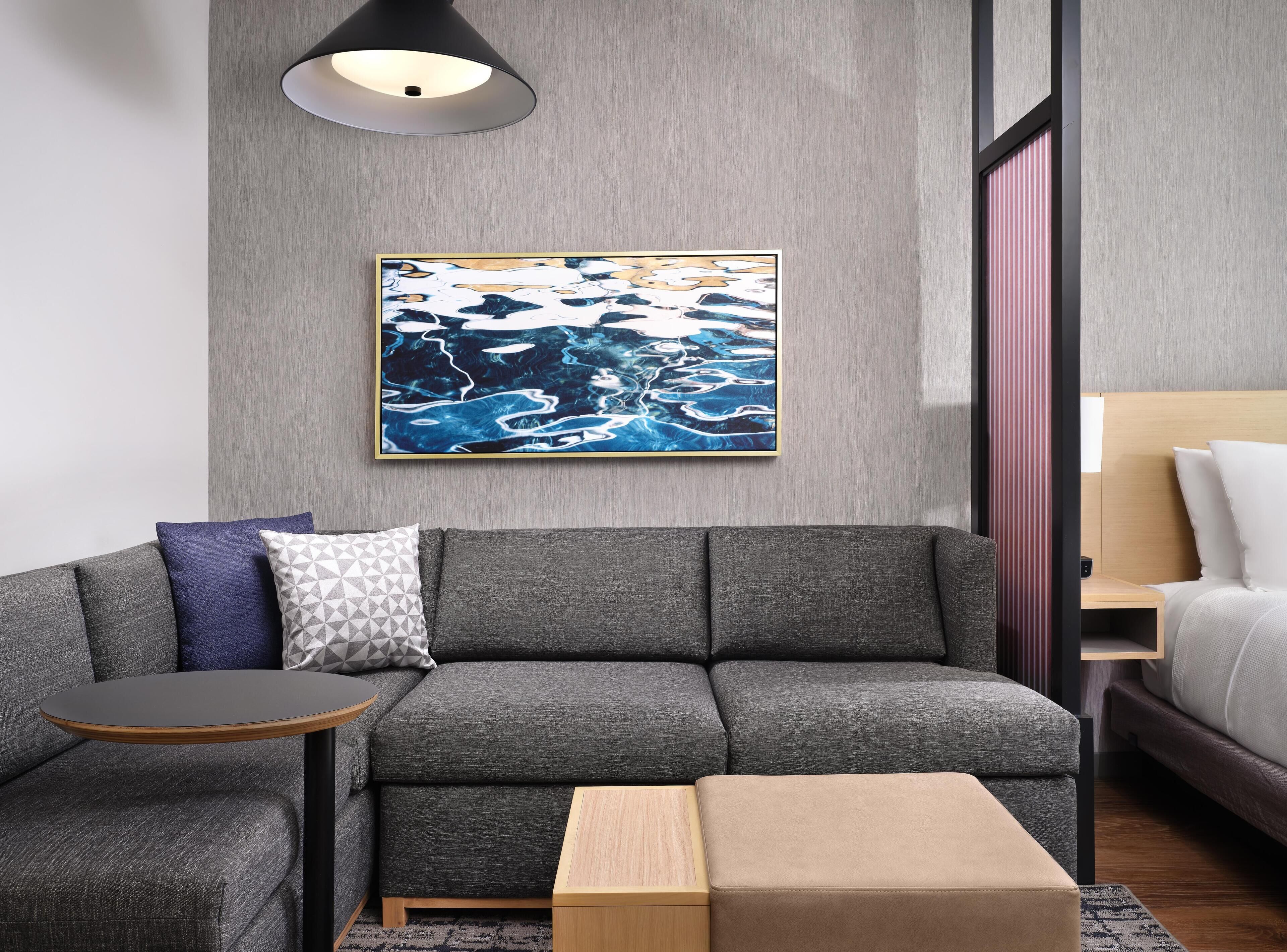 Hypo-allergenic bedding, down duvets, pillow-top beds, in-room safe