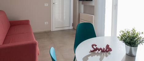 Apartment, 1 Bedroom, Courtyard View (Levante) | Living area | 32-inch TV with digital channels