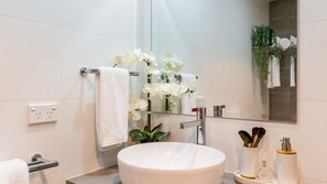 Bathtub, hair dryer, towels