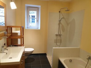 Bathtub, hair dryer, towels