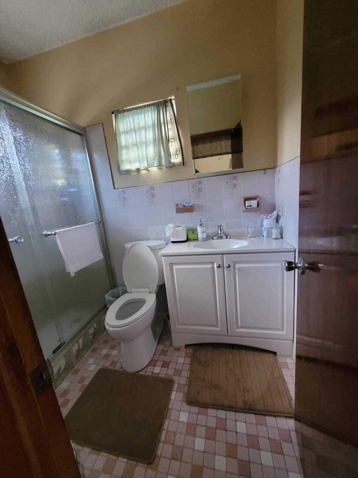 Shower, hair dryer, towels, toilet paper