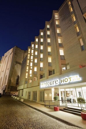 A hotel with a modern facade, a prominent entrance, and a stone building adjacent to it. - Mercure Avignon Centre Palais des Papes Hotel (Avignon)