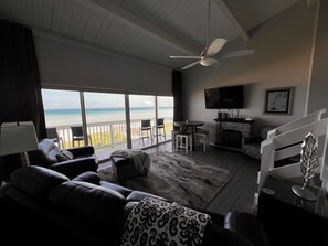 Smart TV, fireplace, books, computer monitors